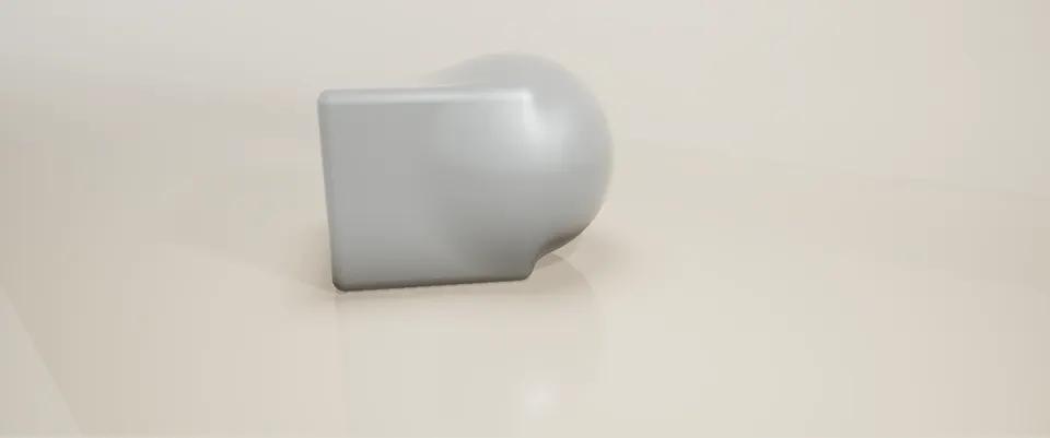 A smooth union of sphere and box in a studio cove, sitting on the floor with contact shadows and reflections.