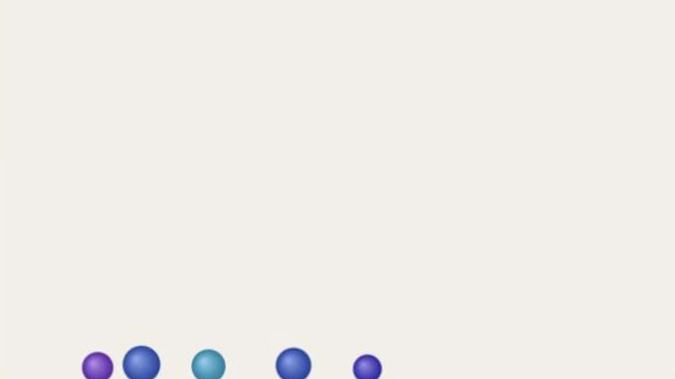 Five colored balls resting against the sandbox floor.